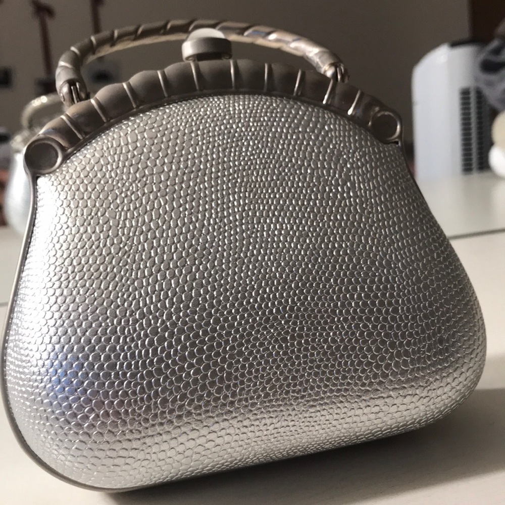 Silver Metal Going Out Clutch